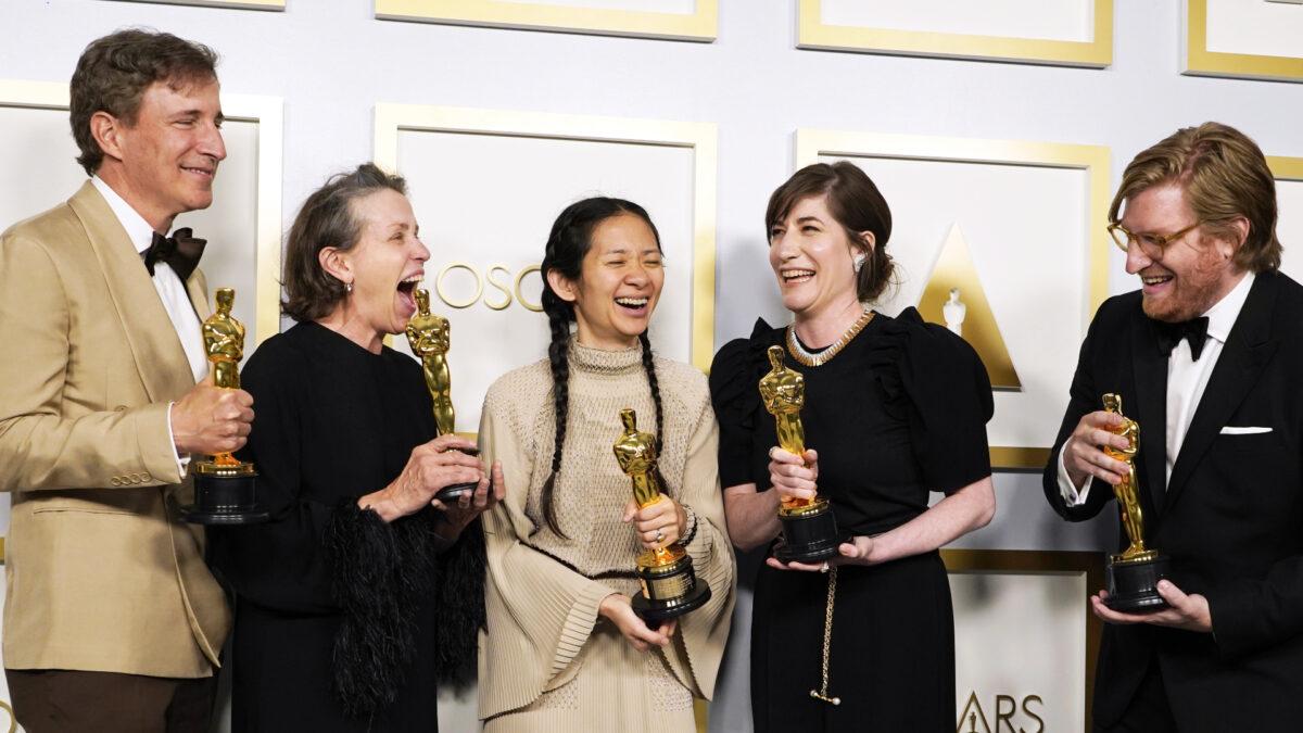 Producers Peter Spears, from (L), Frances McDormand, Chloe Zhao, Mollye Asher and Dan Janvey, winners of the award for best picture for "Nomadland," pose in the press room at the Oscars at Union Station in Los Angeles, Calif., on April 25, 2021. (Chris Pizzello, Pool/AP)