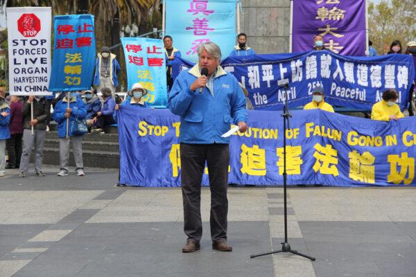 Falun Gong practitioner Chris Kitze speaks at a rally in front of the Ferry Building in San Francisco on April 24, 2021, to raise awareness of the persecution occurring in China. (Jason Blair/The Epoch Times)