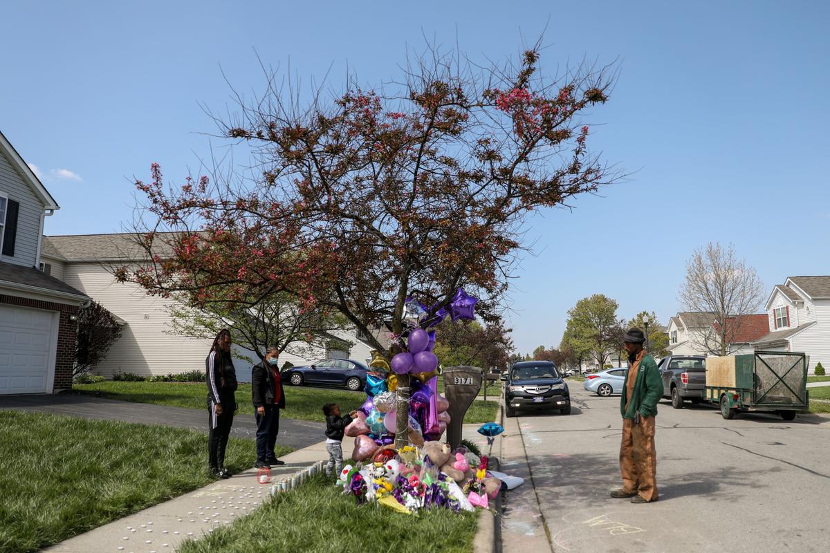People at a memorial for Ma'Khia Bryant on Legion Lane, where a police officer shot the 16-year-old girl as she was attacking a woman with a knife, in Columbus, Ohio, on April 23, 2021. (Samira Bouaou/The Epoch Times)