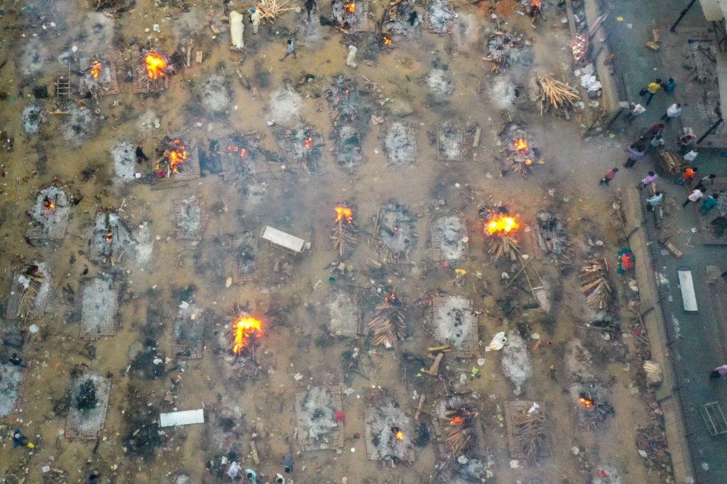 In this aerial picture taken on April 26, 2021, burning pyres of those who lost their lives due to COVID-19 are seen at a cremation ground in New Delhi. (Jewel Samad/Getty Images)
