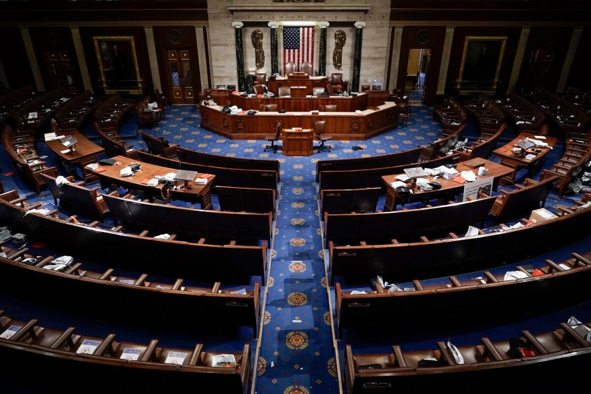 The House Chamber is empty after a hasty evacuation as rioters tried to break into the chamber at the U.S. Capitol in Washington on Jan. 6, 2021. (J. Scott Applewhite/AP Photo)