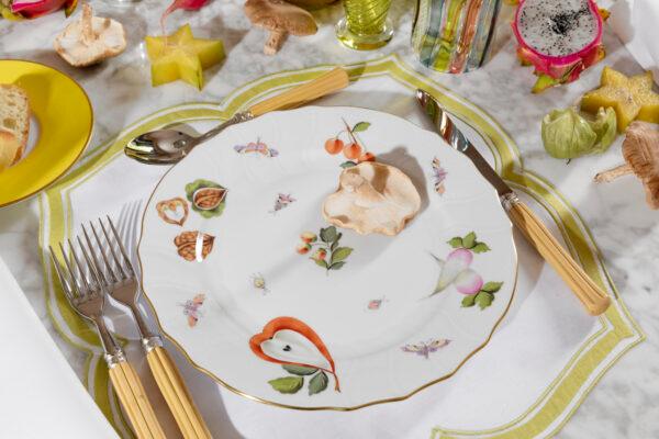 Herend, a Hungary-based porcelain maker, once provided chinaware to the Habsburg dynasty. This particular pattern was introduced in the 1850s, with different fruits and vegetables in quirky arrangements. The plates are made by hand with 24k gold edges. (Market Garden tableware by Herend, $730 for 5-piece place setting, HousesandParties.com)