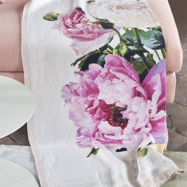 Peonies and roses in vibrant shades of pink and yellow make for the ideal sofa throw. (Designers Guild Tourangelle Peony Throw, $310, FigLinensandHome.com)