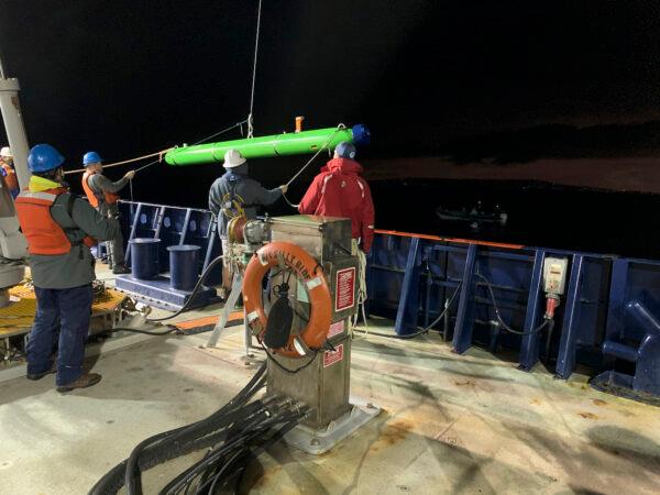 In this March 2021 image provided by Scripps Institution of Oceanography at UC San Diego, researchers aboard the research vessel Sally Ride deploy an autonomous underwater vehicle near Santa Catalina Island, Calif. (Scripps Institution of Oceanography at UC San Diego via AP)
