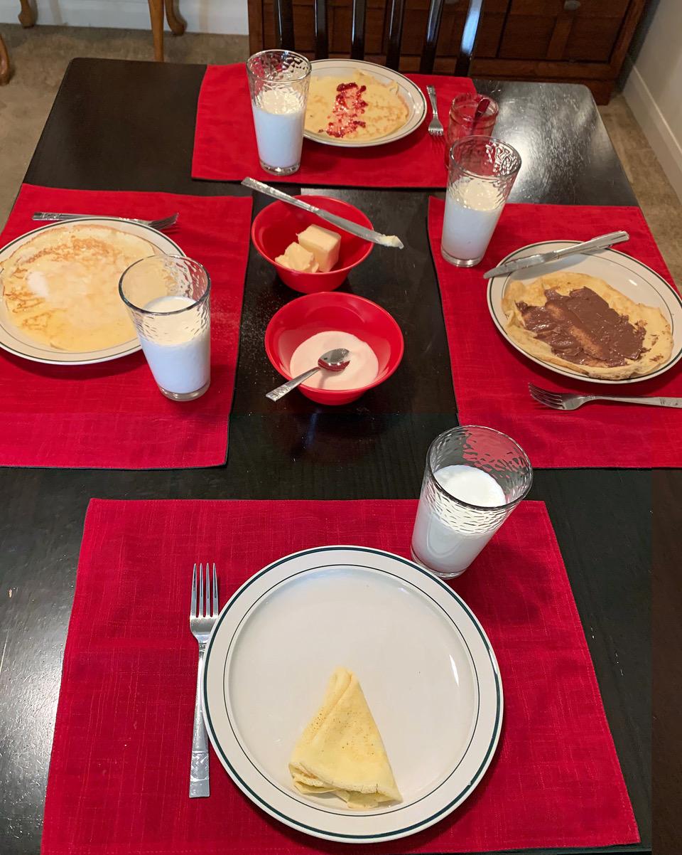 Norwegian pancakes served with raspberry jam, Nutella, butter, and sugar, to be folded into triangles to eat with your hands. (Courtesy of Charlotte McDonald)