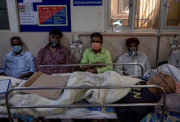 Patients suffering from the coronavirus disease (COVID-19) receive treatment inside the emergency ward at Holy Family hospital in New Delhi, India, on April 29, 2021. (Danish Siddiqui/Reuters)