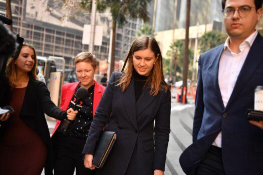 Former political staffer Brittany Higgins (centre) leaves the Commonwealth Parliamentary Offices after meeting with the Leader of the Federal Opposition Anthony Albanese in Sydney, Australia, on April 30, 2021. Higgins is campaigning for a change in workplace behaviour towards women (AAP Image/Dean Lewins)
