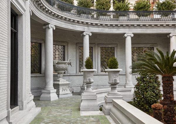 Stately granite Ionic columns stand tall in the portico, inspired by the villas designed by Italian Renaissance architect Andrea Palladio. (Thomas Loof Photography)