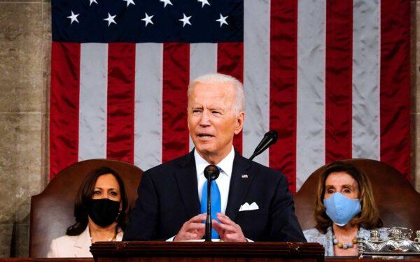President Joe Biden, flanked by Vice President Kamala Harris, left, and House Speaker Nancy Pelosi, addresses a joint session of Congress at the Capitol in Washington on April 28, 2021. (Melina Mara/Pool/AFP via Getty Images/TNS)
