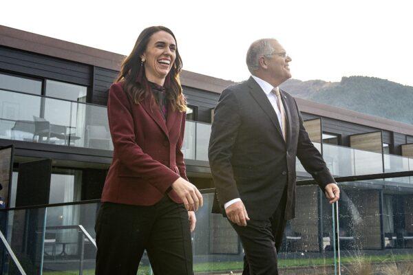 New Zealand's Prime Minister Jacinda Ardern (L) walks onto a balcony at the Nest with Australia's Prime Minister Scott Morrison ahead of the Australia-New Zealand Leaders' Meeting in Queenstown on May 31, 2021. (Joe Allison / Pool / AFP via Getty Images)