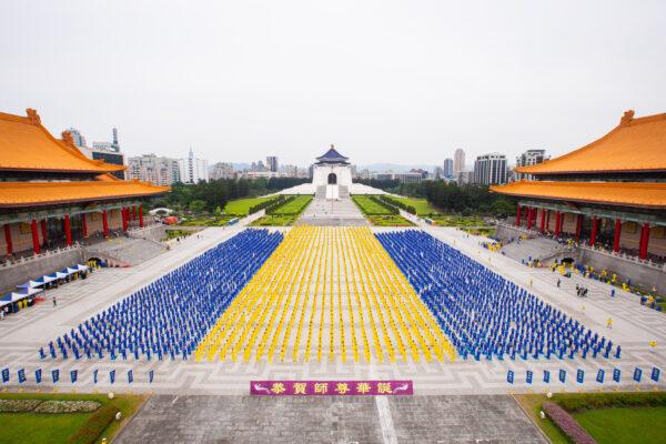 Falun Gong adherents practice meditative exercises to celebrate World Falun Dafa Day in Taipei, Taiwan, on May 1, 2021. (Chen Po-chou/The Epoch Times)
