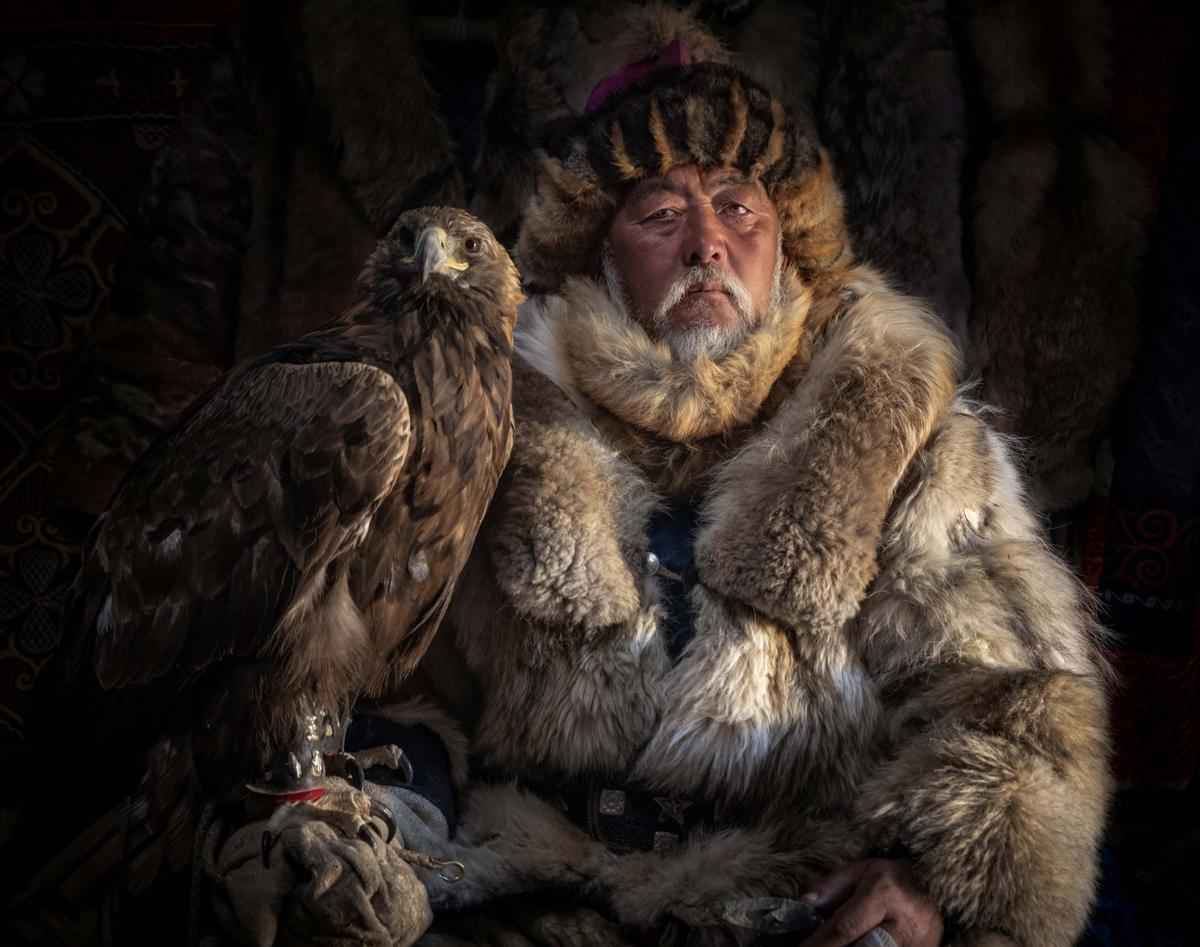This incredible image depicts a Mongolian hunter, or "berkutchi," who uses trained golden eagles to hunt for food. (SWNS)