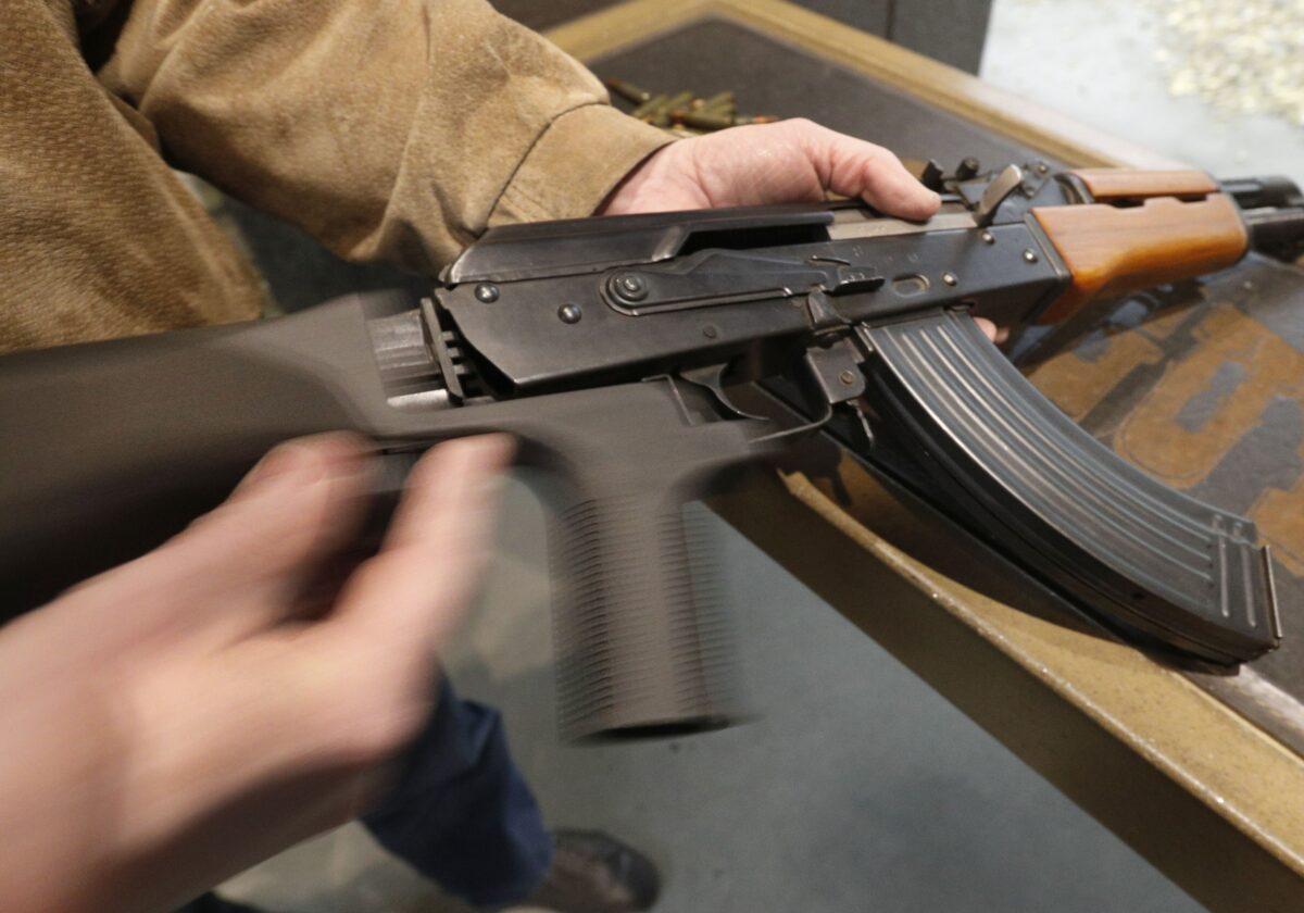  A bump stock is installed on an AK-47-style rifle and its movement is demonstrated at Good Guys Gun and Range in Orem, Utah, on Feb. 21, 2018. (George Frey/Getty Images)