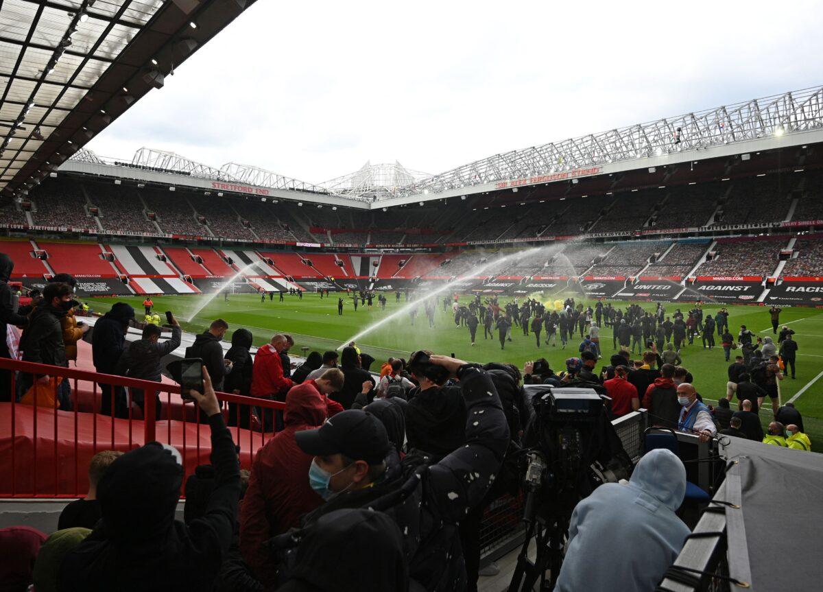 Supporters protest against Manchester United's owners, inside English Premier League club Manchester United's Old Trafford stadium in Manchester, northwest England, on May 2, 2021. (Oli Scarff/AFP via Getty Images)