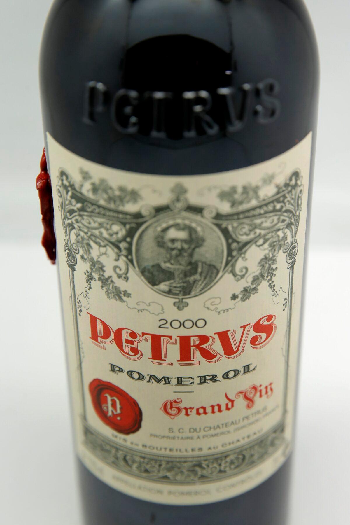 A bottle of Petrus red wine that spent a year orbiting the world in the International Space Station is pictured in Paris, on May 3, 2021. (Christophe Ena/AP Photo)