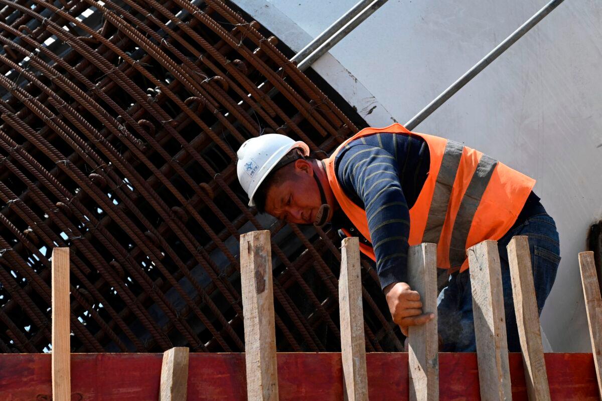 A Chinese laborer works at a construction site of Colombo Port City, a part of China's trillion-dollar Belt and Road plan in Colombo, Sri Lanka, on Feb. 24, 2020. (Ishara S. Kodikara/AFP via Getty Images)