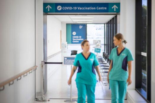 Nurses are seen walking out of the Covid-19 Vaccine wing of Gold Coast University Hospital in Gold Coast, Australia, on Feb. 22, 2021. (Glenn Hunt/Getty Images)