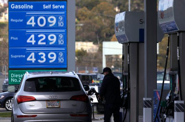 A customer pumps gas into his vehicle at a Chevron gas station in Mill Valley, Calif., on March 3, 2021. (Justin Sullivan/Getty Images)
