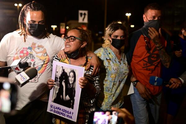 Keila Ortiz, the mother of Keishla Rodriguez, second from left, cries out for justice after boxer Felix Verdejo was arrested in connection with the death of her 27-year-old pregnant daughter whose body was found in a lagoon, outside FBI headquarters in San Juan, Puerto Rico, on May 2, 2021. (Carlos Giusti/AP Photo)