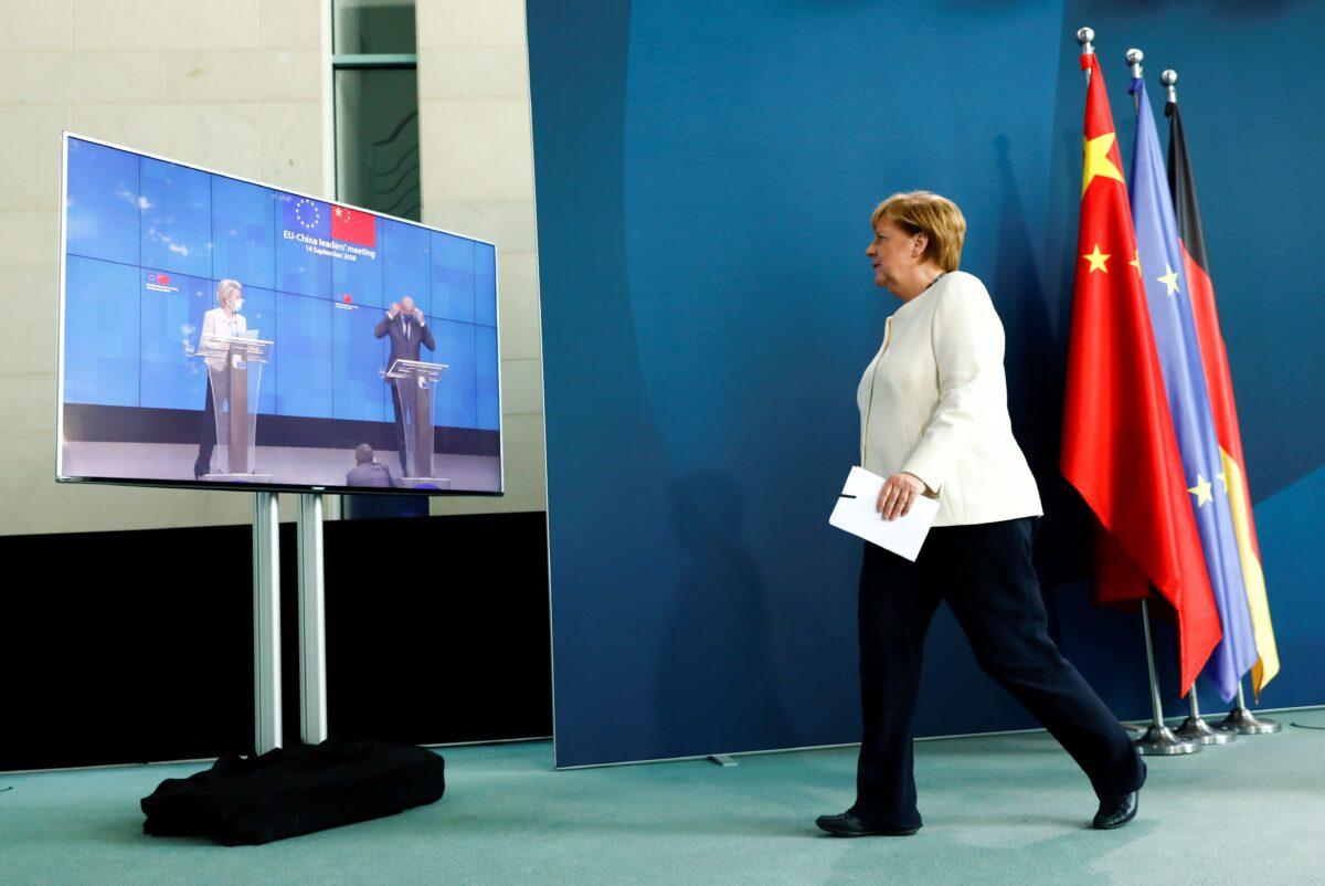 German Chancellor Angela Merkel walks after holding a video news conference with European Council President Charles Michel and European Commission President Ursula von der Leyen following a virtual summit with China's President Xi Jinping, at the Chancellery in Berlin, on Sept. 14, 2020. (Michele Tantussi/Pool/Reuters)