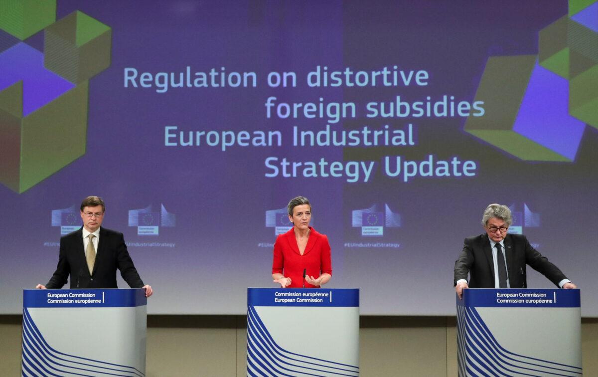 European Commission Vice Presidents Margrethe Vestager and Valdis Dombrovskis, and EU Commissioner for Internal Market Thierry Breton hold a news conference in Brussels, Belgium, on May 5, 2021. (Yves Herman/Reuters)