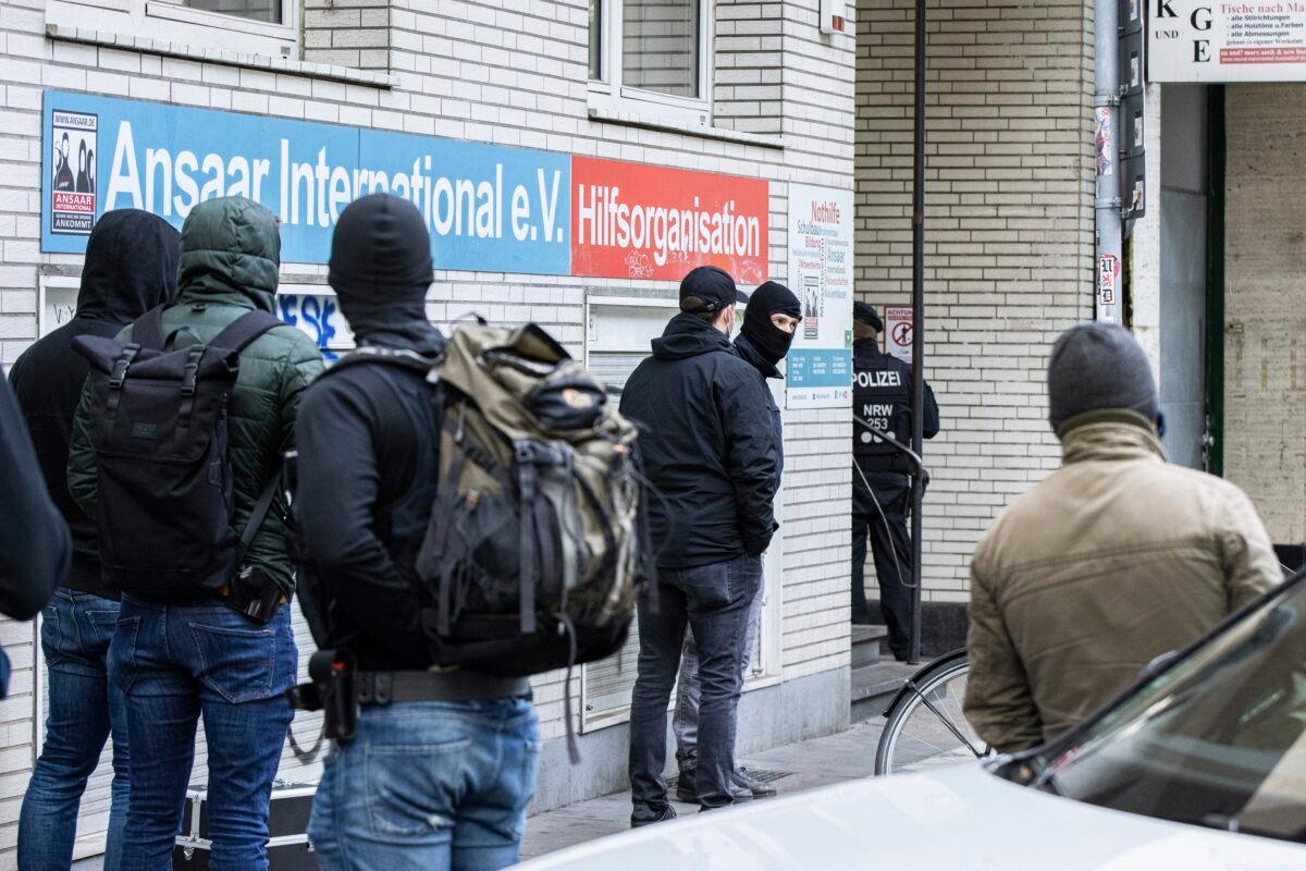 Police officers stay in front of a building of the Ansaar International association in Duesseldorf, Germany, on May 5. 2021. (Marcel Kusch/dpa via AP)