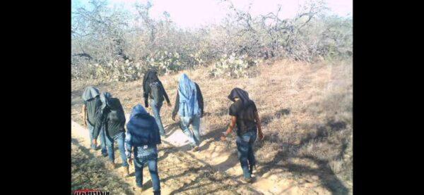 A photo from a game camera caught illegal aliens walking through private ranch land in Jim Hogg County, Texas, on March 25, 2021. (Courtesy of Susan Kibbe)