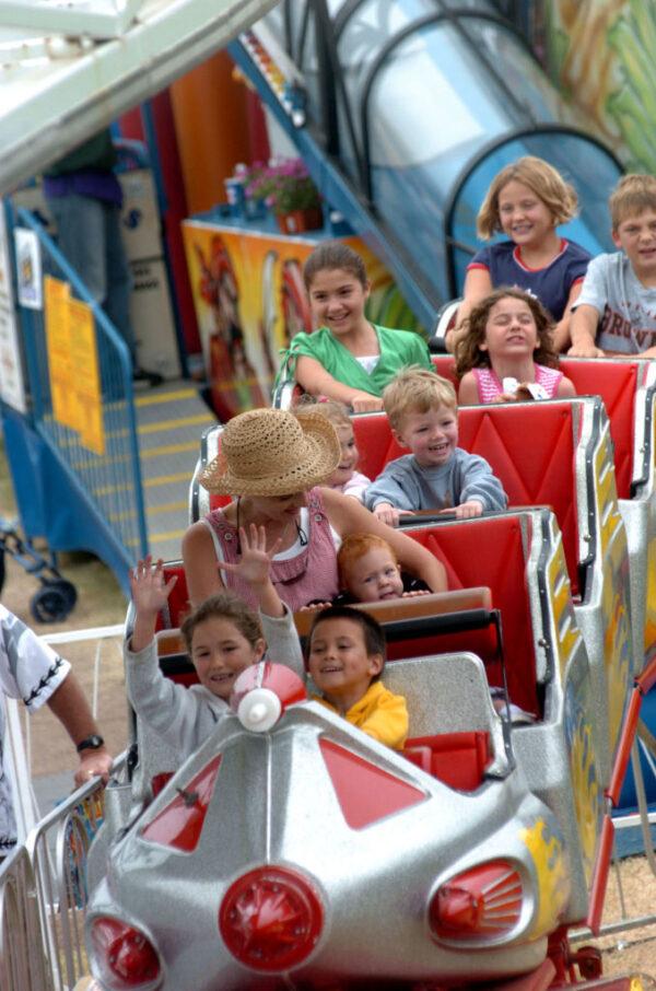 Young fair-goers enjoy a rollercoaster ride at the San Diego County Fair June 29, 2005, in Del Mar, Calif. (Sandy Huffaker/Getty Images)