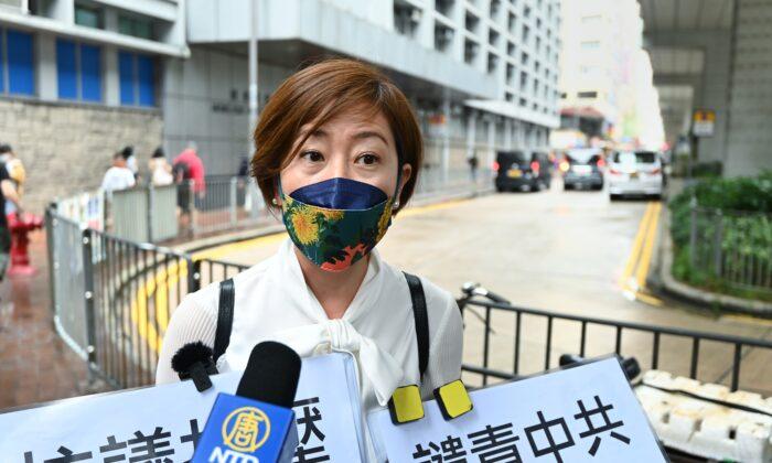 Sarah Liang, a reporter at The Epoch Times Hong Kong edition, gives an interview before reporting harassment to the police at Mongkok Police Station in Hong Kong on April 27, 2021. (Sung Bi Lung/The Epoch Times）