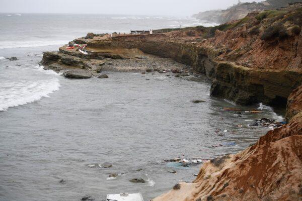 Wreckage and debris from a capsized boat washes ashore at Cabrillo National Monument near where a boat capsized just off the San Diego coast, in San Diego, Calif., on May 2, 2021. (Denis Poroy/AP Photo)