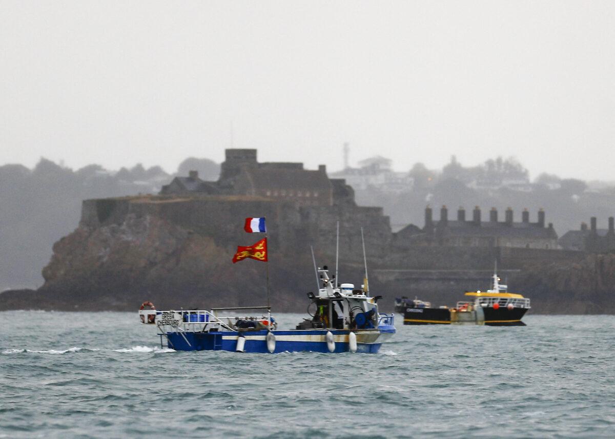 French fishing boats protest in front of the port of Saint Helier off the British island of Jersey to draw attention to what they see as unfair restrictions on their ability to fish in UK waters after Brexit, on May 6, 2021. (Sameer Al-Doumy/AFP via Getty Images)