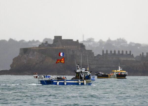 French fishing boats protest in front of the port of Saint Helier off the British island of Jersey to draw attention to what they see as unfair restrictions on their ability to fish in UK waters after Brexit, on May 6, 2021. (Sameer Al-Doumy/AFP via Getty Images)
