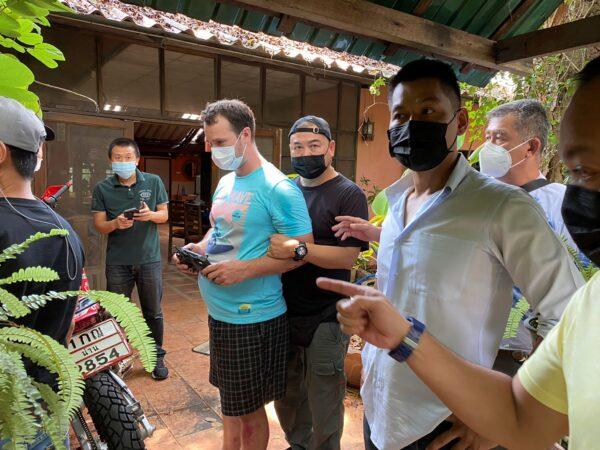 Police arrest and interrogate American citizen Jason Matthew Balzer, center, in Chiang Mai province northern Thailand before charging him for intentionally murdering his pregnant wife in Nan province, Thailand, on May 6, 2021 (Thai Provincial Police Region 5 via AP)