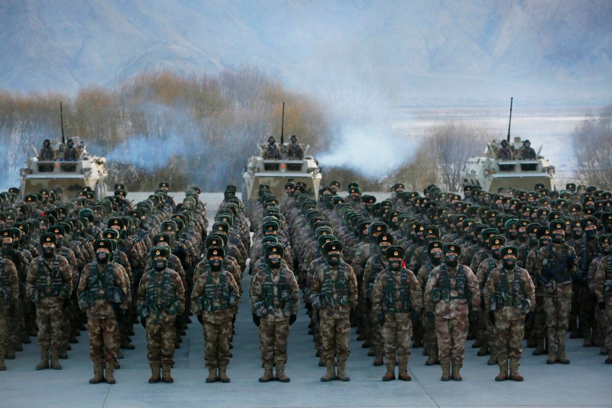 Chinese People's Liberation Army (PLA) soldiers line up during military training at Pamir Mountains in Kashgar, China, on Jan. 4, 2021. (STR/AFP via Getty Images)