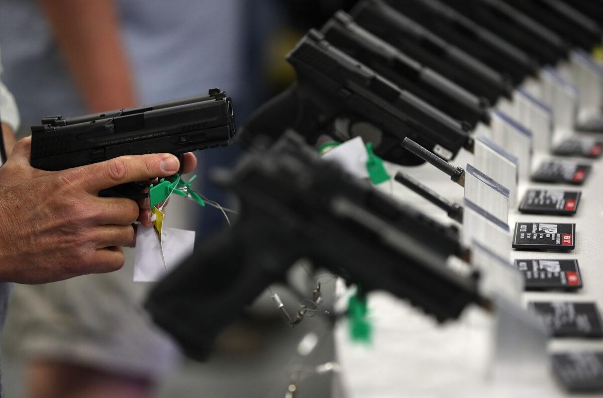 Smith and Wesson handguns are displayed during the NRA Annual Meeting & Exhibits at the Kay Bailey Hutchison Convention Center in Dallas, Texas, on May 5, 2018. (Justin Sullivan/Getty Images)