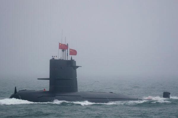 A Great Wall 236 submarine of the Chinese People's Liberation Army (PLA) Navy, billed by Chinese state media as a new type of conventional submarine, participates in a naval parade to commemorate the 70th anniversary of the founding of China's PLA Navy in the sea near Qingdao, in eastern China's Shandong province on April 23, 2019. (Mark Schiefelbein/AFP via Getty Images)