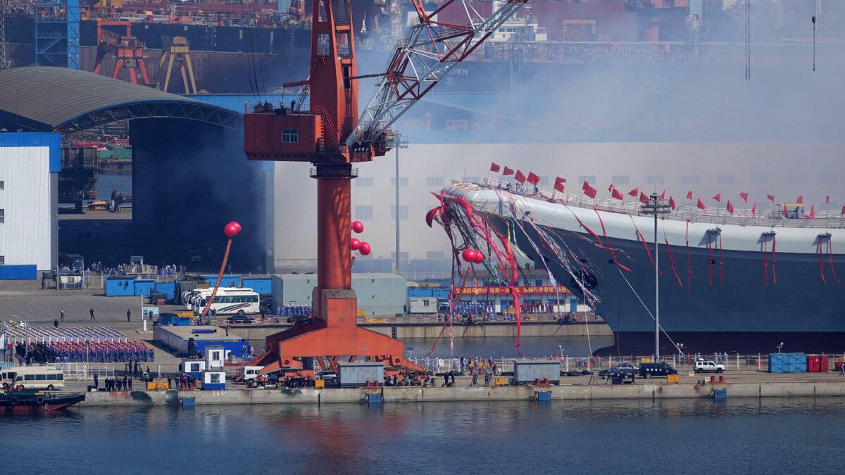 Type 001A, China's second aircraft carrier, is transferred from the dry dock into the water during a launch ceremony at a shipyard in Dalian, Liaoning Province, China, on April 26, 2017. China has launched its first domestically designed and built aircraft carrier, state media said on April 26, as the country seeks to transform its navy into a force capable of projecting power onto the high seas. (STR/AFP via Getty Images)