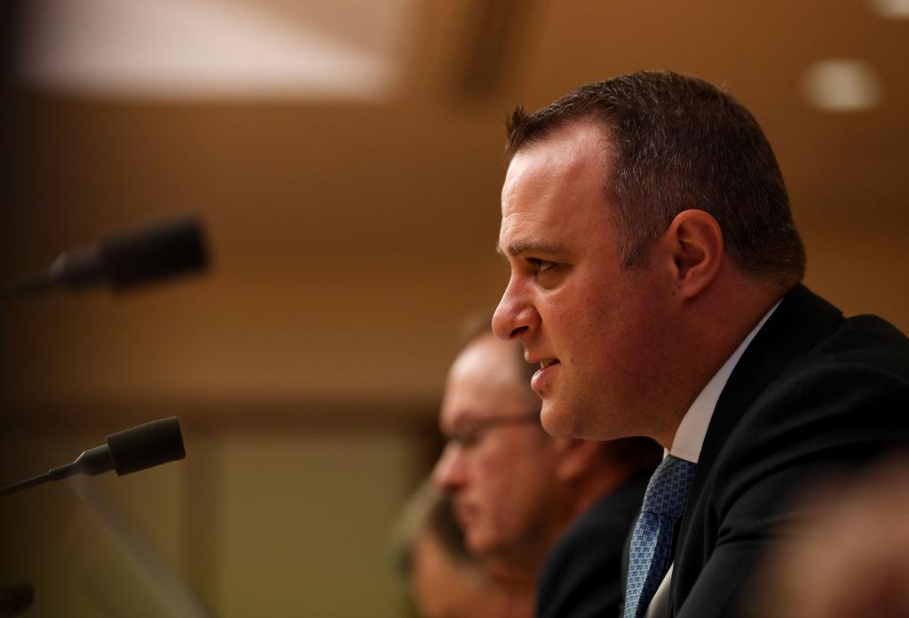 MP Tim Wilson speaks to Reserve Bank Governor Philip Lowe at the House of Representatives Economics Committee at Parliament House in Canberra, Australia on Feb. 7, 2020. (Tracey Nearmy/Getty Images)