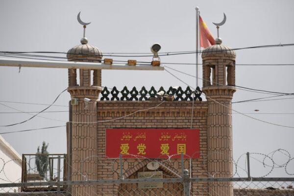 The Jieleixi No.13 village mosque with slogans “Love the [Chinese Communist] Party, Love China,” in Yangisar, south of Kashgar, in China’s western Xinjiang region, on June 4, 2019. (Greg Baker/AFP via Getty Images)
