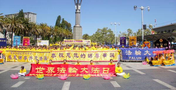 Hundreds of Bay Area Falun Gong practitioners wish their teacher, Li Hongzhi, a happy birthday in San Francisco on May 8, 2021. Li’s birthday is May 13, the same day as World Falun Dafa Day. (David Lam/The Epoch Times)
