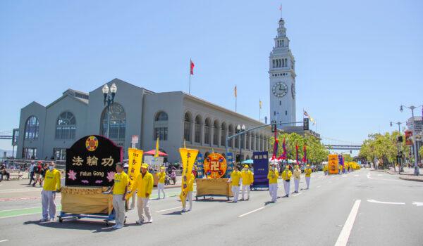 Hundreds of Bay Area Falun Gong practitioners participate in a parade in front of the Ferry Building to celebrate World Falun Dafa Day in San Francisco on May 8, 2021. (David Lam/The Epoch Times)