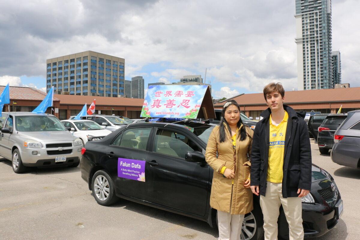 Omar Tuzovic, a resident of Scarborough, attends the car parade with his wife to celebrate World Falun Dafa Day and raise awareness of the ongoing persecution, in Toronto, Canada, on May 8, 2021. (Andrew Chen/The Epoch Times)