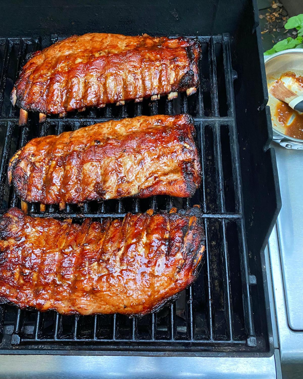 A simple spice rub drives in more flavor to these ribs, which get a final baste and garnish with a smoky chipotle-laced barbecue sauce. (Lynda Balslev for Tastefood)