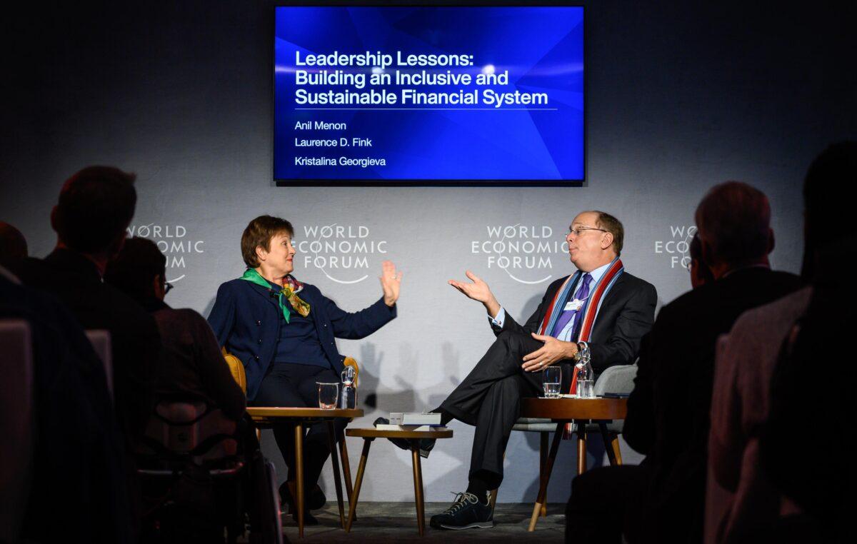 International Monetary Fund (IMF) Managing Director Kristalina Georgieva (L) talks with BlackRock Chair and CEO Laurence D. Fink during a session at the World Economic Forum (WEF) annual meeting in Davos on Jan. 23, 2020. (Fabrice Coffrini/AFP via Getty Images)
