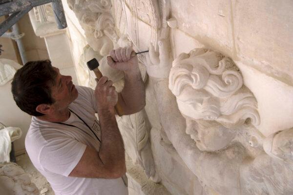 A stone carver restores the stonework to its former glory. (Didier Saulnier/Château de Versailles)