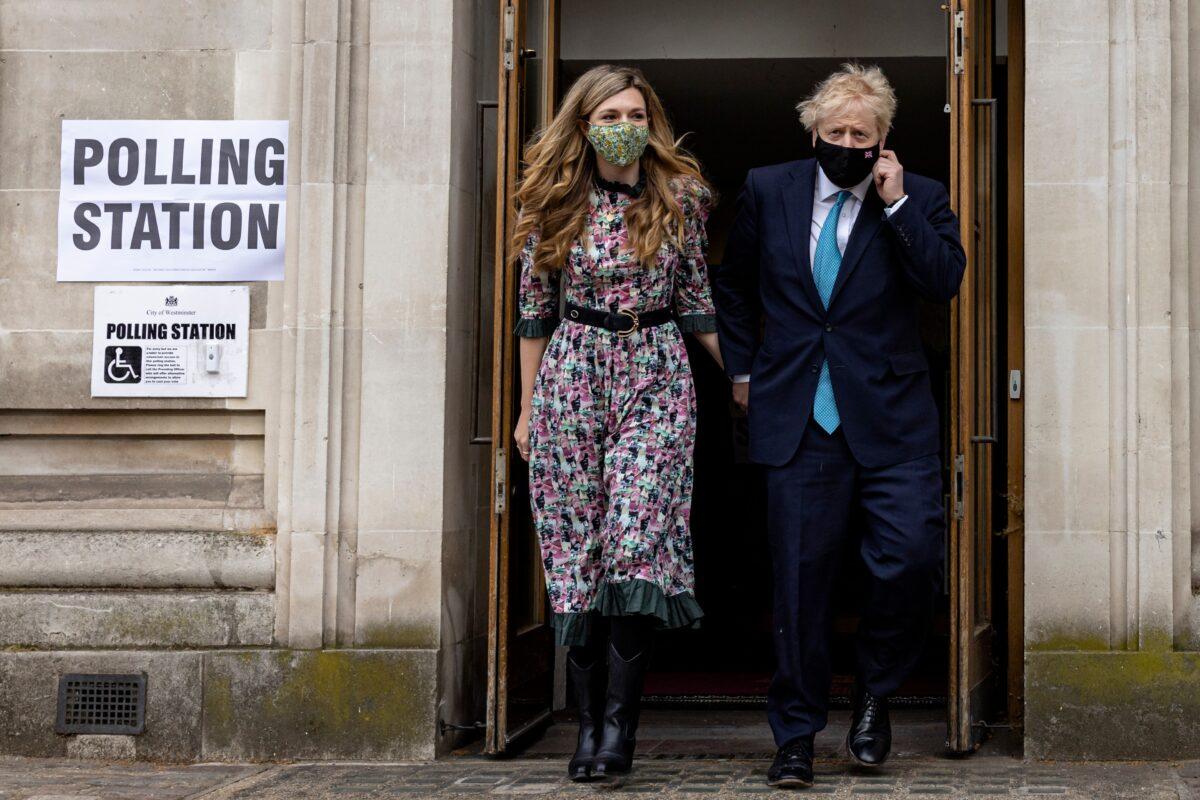 Prime Minister Boris Johnson and his fiancée Carrie Symonds leave Methodist Central Hall in Westminster, London, after voting on May 06, 2021. (Rob Pinney/Getty Images)