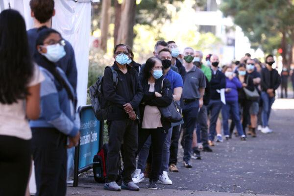 People are seen queuing to enter a mass COVID-19 vaccination hub on May 10, 2021, in Sydney, Australia. (Mark Kolbe/Getty Images)