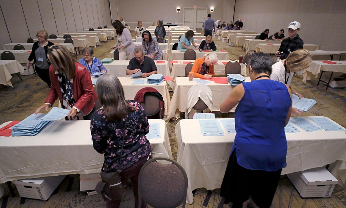 Tellers begin counting ballots for Virginia's Republican gubernatorial nominee race inside a ballroom at the Marriott Hotel in Richmond, Va., on May 10, 2021. (Bob Brown/Richmond Times-Dispatch via AP)