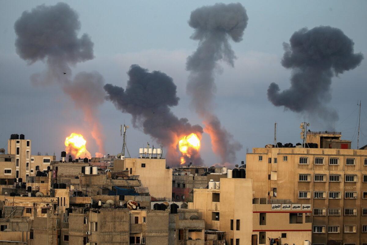 Flames and smoke rise during air strikes amid a flare-up of violence, in the southern Gaza Strip, on May 11, 2021. (Ibraheem Abu Mustafa/TPX Images of the Day/Reuters)