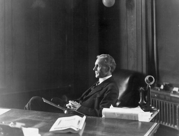 Inventor and industrialist Henry Ford (1863–1947) sitting at his desk in his office in Highland Park, Mich. (Hulton Archive/Getty Images)